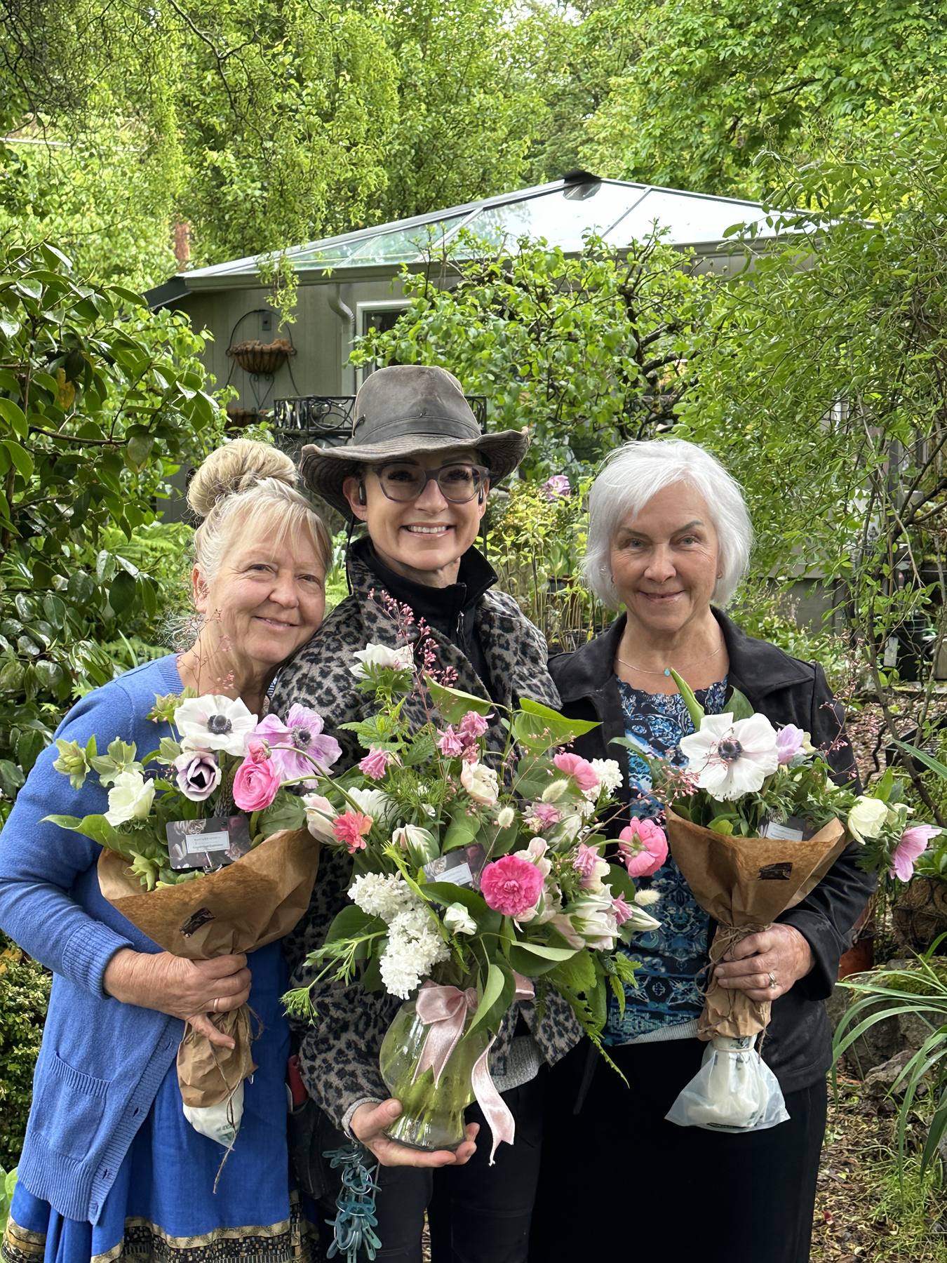 Friends holding garden bouquets