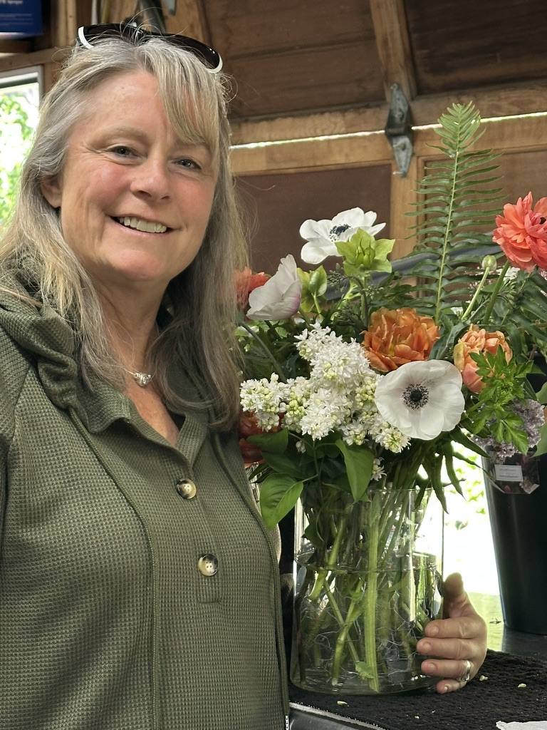 Guest holding a fresh arrangement