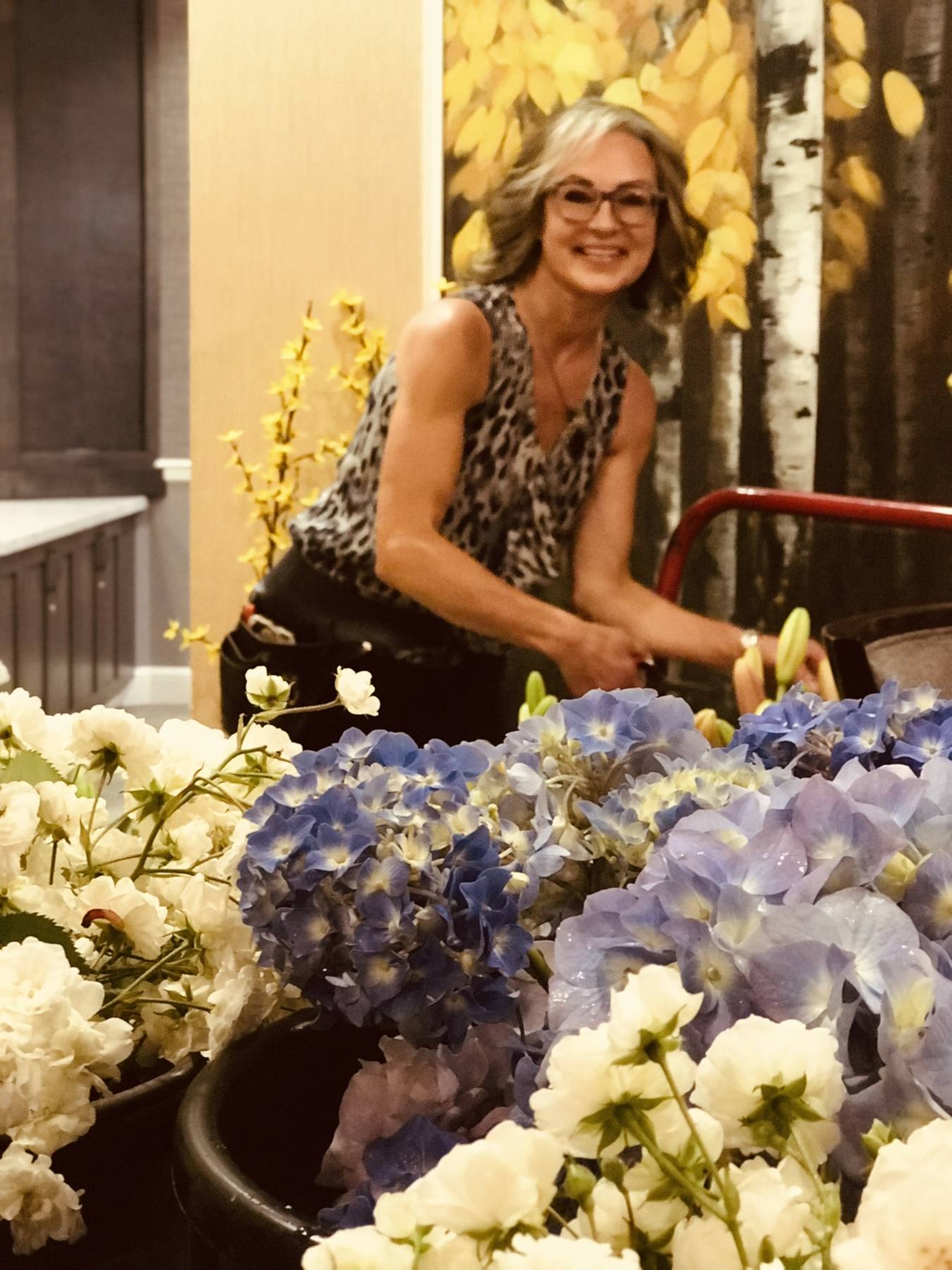 Sonia arranging flowers